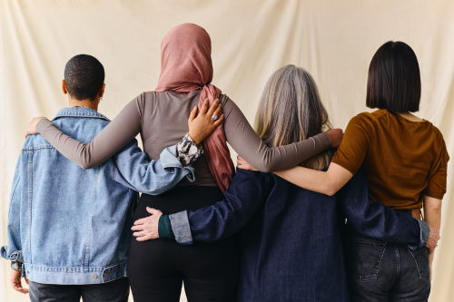 Photo of people from diverse backgrounds supporting each other